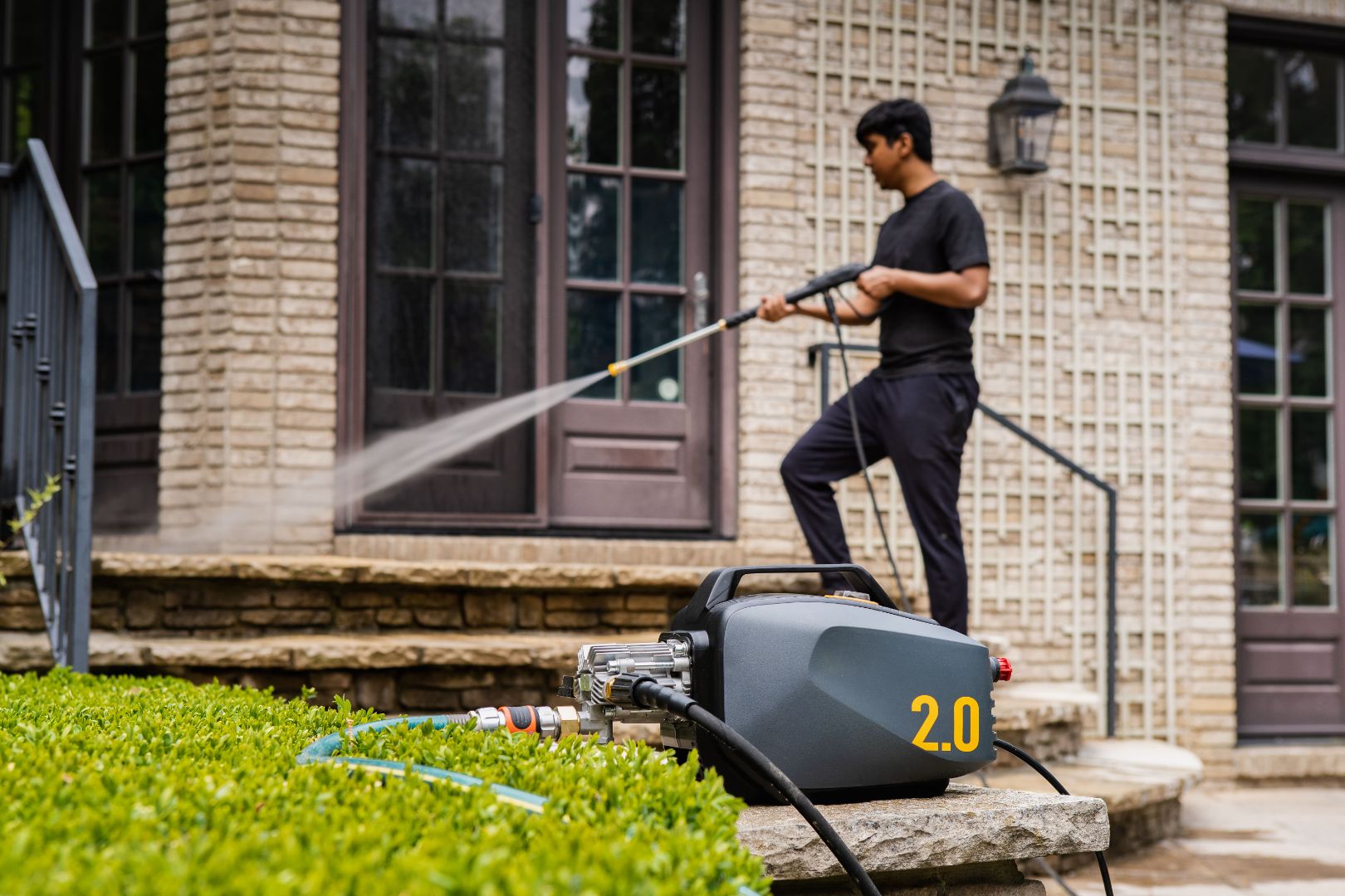 A guy using Active 2.0 Pressure washer that can be winterize