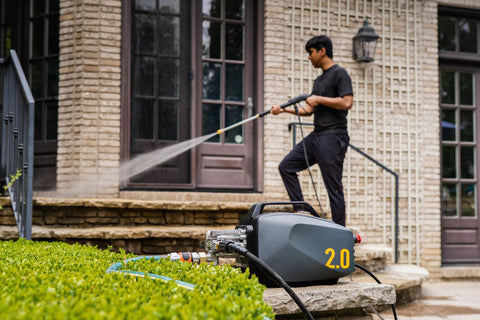 A guy using Active 2.0 Pressure washer that can be winterize