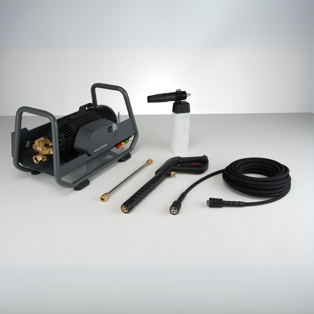 Pressure washer set including a black Active™ 2.3 Electric Pressure Washer motor unit, spray gun, nozzles, detergent bottle, and a coiled black hose, displayed on a light grey surface against a white background.